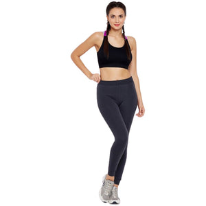 Deevaz Medium Impact Padded Non-Wired Sports Bra In Black Color With Lavender Cross Back Strap Detailing.