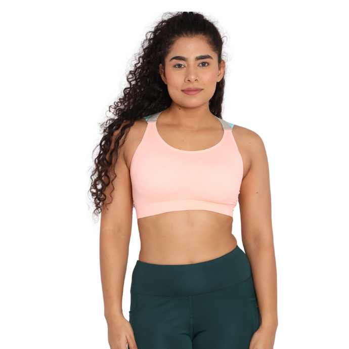 Deevaz Medium Impact Padded Non-Wired Sports Bra In Peach Color Cross Back Strap Detailing.