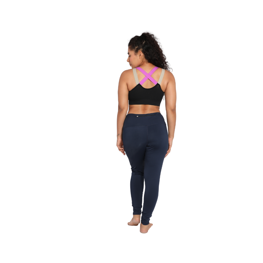Deevaz Medium Impact Padded Non-Wired Sports Bra In Black Color With Lavender Cross Back Strap Detailing.