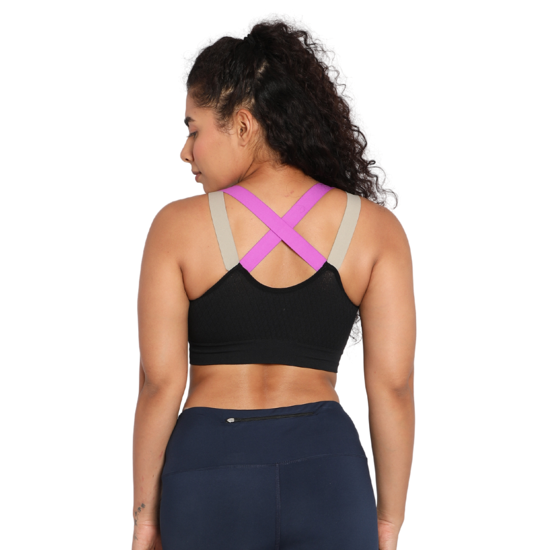 Deevaz Medium Impact Padded Non-Wired Sports Bra In Black Color With Lavender Cross Back Strap Detailing.